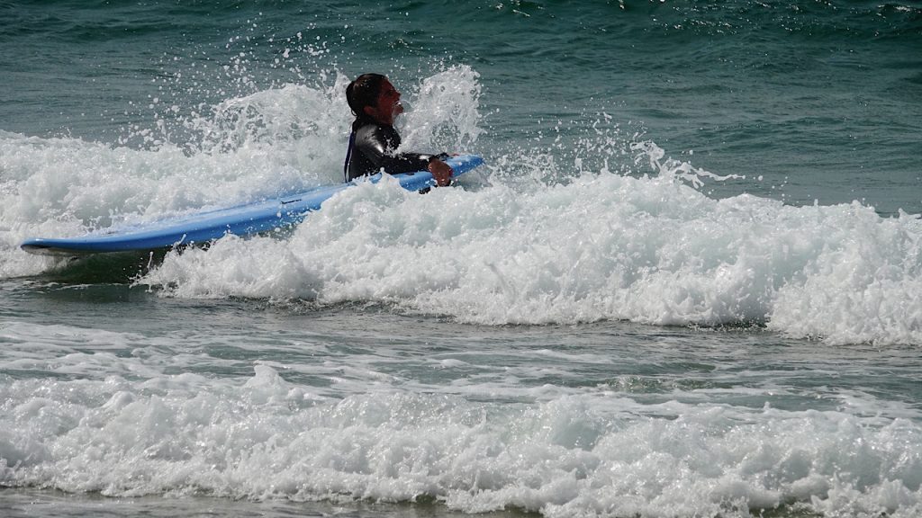 Azul Beach surfers, Portugal
