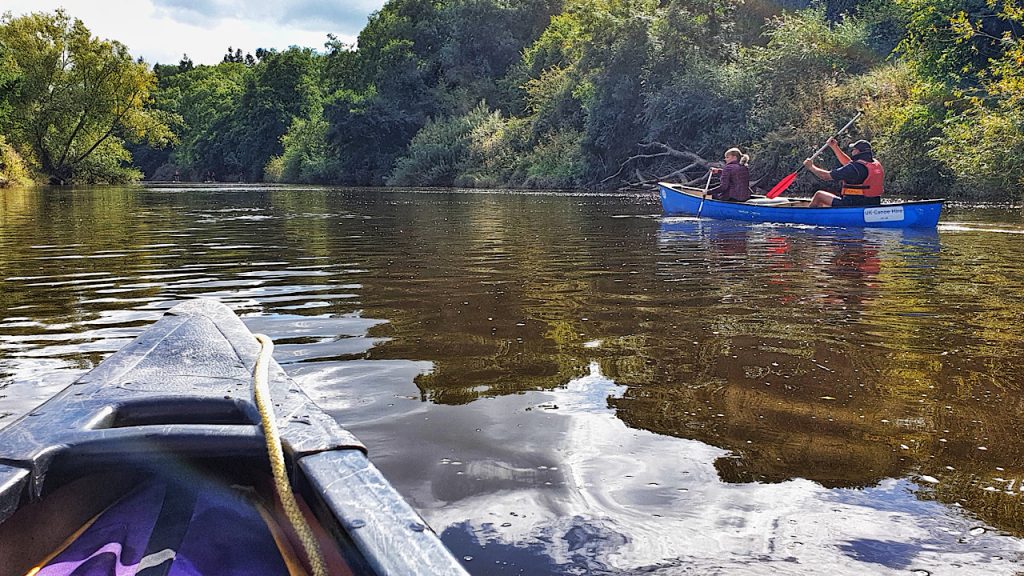 On board with a kayak on the river Wye